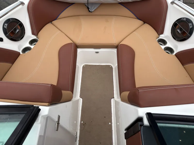 Slide: The Image of Interior of a 2018 MasterCraft XT 20 boat with brown seating. - 14