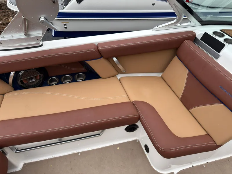 Slide: The Image of Interior of a 2018 MasterCraft XT 20 boat with brown leather seats. - 7