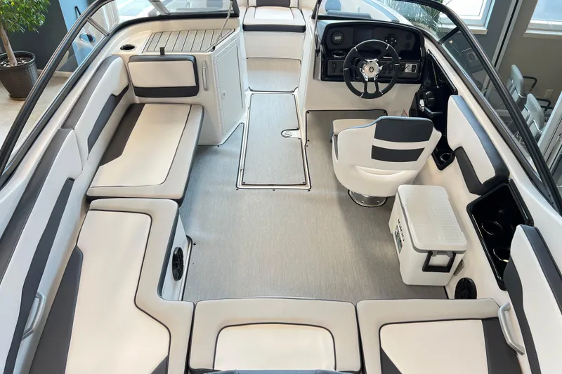 Slide: The Image of 2024 Yamaha Boats AR195 interior with sleek seating and modern dashboard design. - 4