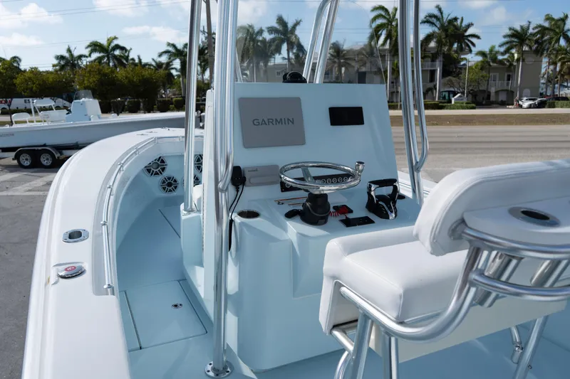 Slide: The Image of 2024 Contender 25 Tournament boat interior with Garmin navigation system and steering console. - 10