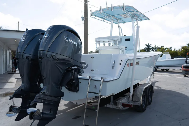 Slide: The Image of 2024 Contender 25 Tournament boat with dual Yamaha engines on a trailer. - 11