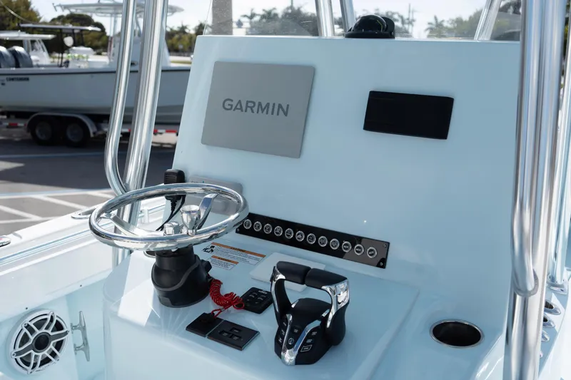 Slide: The Image of 2024 Contender 25 Tournament boat console with Garmin navigation system and steering wheel. - 6