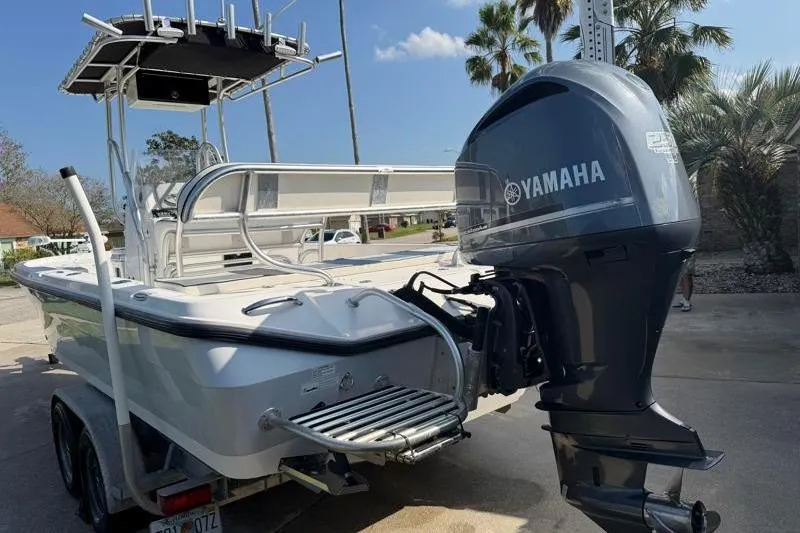Slide: The Image of 2012 Edgewater 240 Inshore boat with Yamaha outboard motor on trailer. - 17