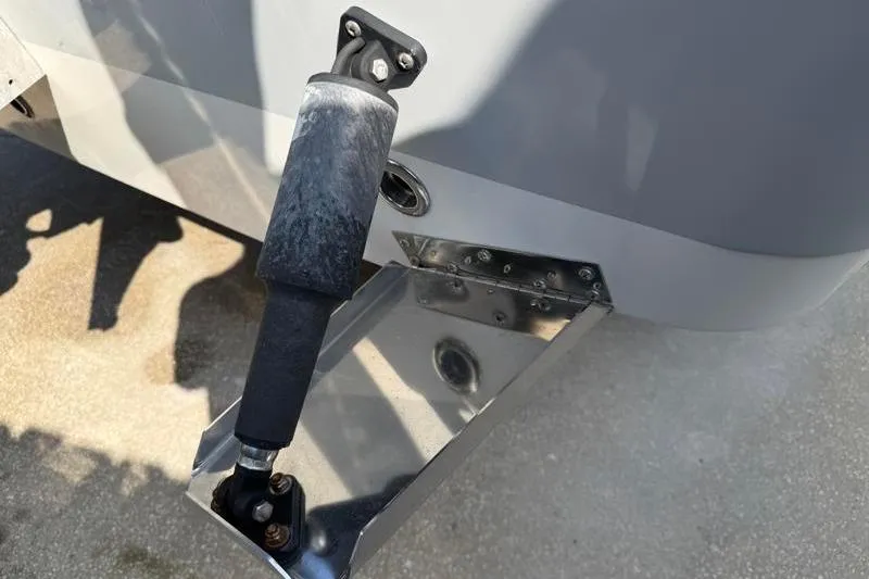 Slide: The Image of Edgewater 240 Inshore 2012 boat trim tab and hydraulic actuator detail. - 21