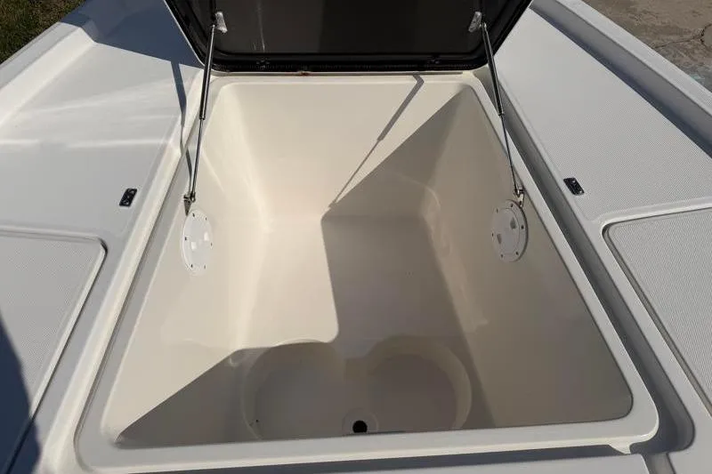 Slide: The Image of Open storage compartment on a 2012 Edgewater 240 Inshore boat, showcasing spacious interior. - 35