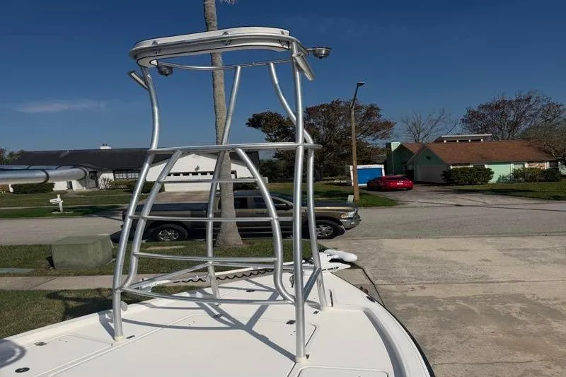 Slide: The Image of Aluminum tower on 2012 Edgewater 240 Inshore boat, parked in residential area. - 4