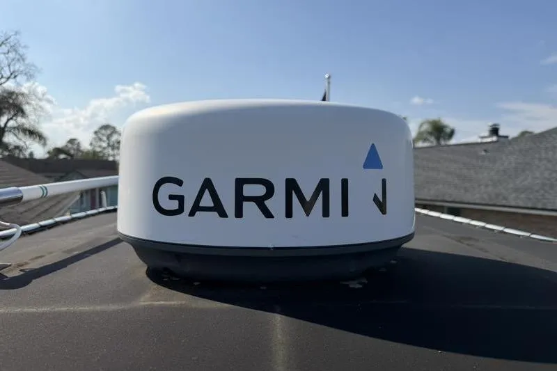 Slide: The Image of Garmin radar on 2012 Edgewater 240 Inshore boat under clear blue sky. - 42