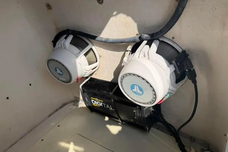 Slide: The Image of Speakers and amplifier setup on a 2012 Edgewater 240 Inshore boat. - 48
