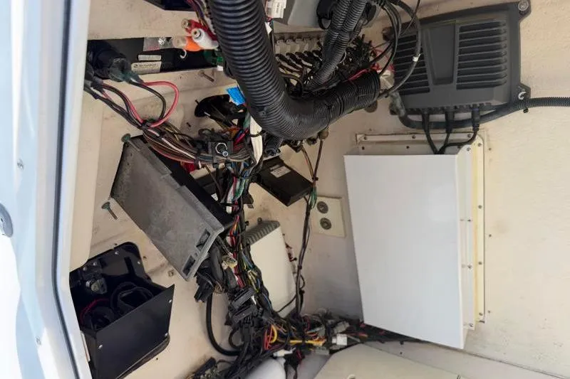 Slide: The Image of Electrical wiring and components inside a 2012 Edgewater 240 Inshore boat. - 49
