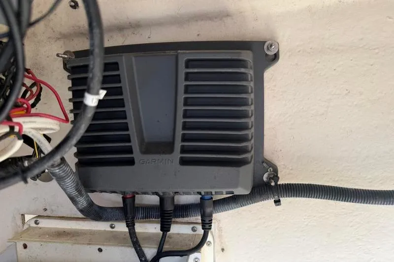 Slide: The Image of Garmin device installed on a 2012 Edgewater 240 Inshore boat, with visible wiring. - 50