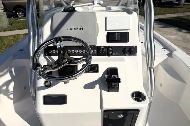 Slide: The Image of Edgewater 240 Inshore 2012 boat console with Garmin and Yamaha controls. - 52