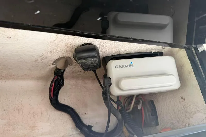 Slide: The Image of Garmin device installed in a 2012 Edgewater 240 Inshore boat compartment. - 54