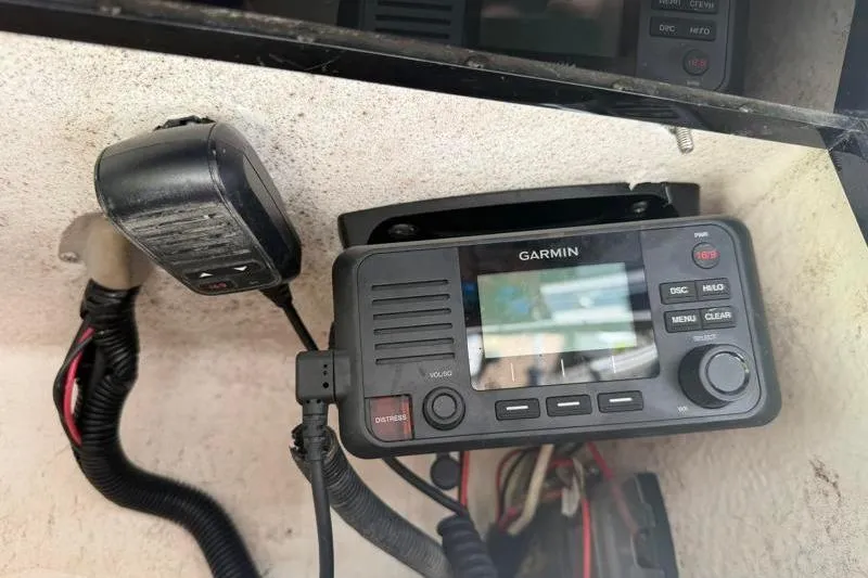 Slide: The Image of Garmin marine radio and microphone installed on a 2012 Edgewater 240 Inshore boat. - 55