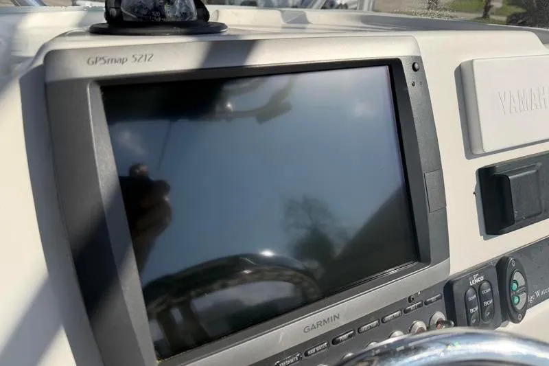 Slide: The Image of Garmin GPSmap 5212 on 2012 Edgewater 240 Inshore boat dashboard. - 56