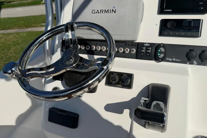Slide: The Image of Steering console of 2012 Edgewater 240 Inshore boat with Garmin navigation system. - 60