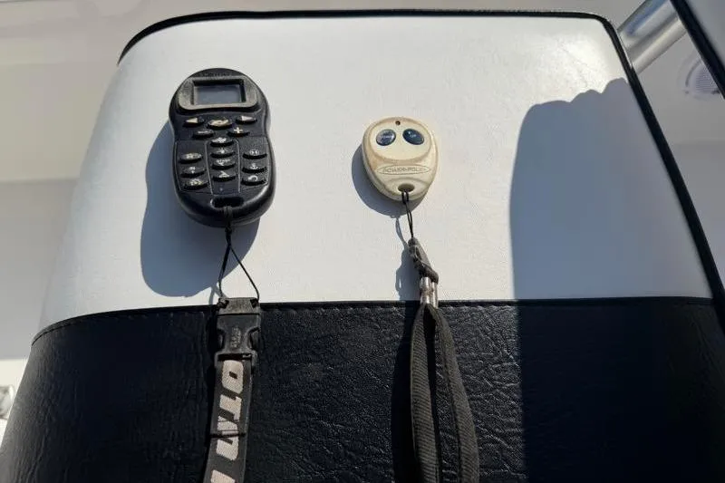 Slide: The Image of Control panel with devices on a 2012 Edgewater 240 Inshore boat. - 61