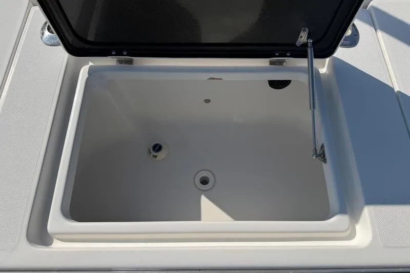 Slide: The Image of Open storage compartment on 2012 Edgewater 240 Inshore boat. - 64