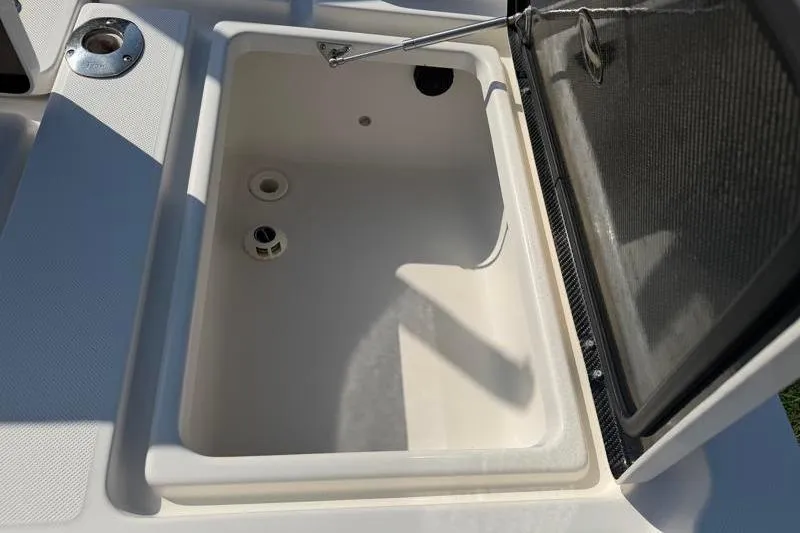 Slide: The Image of Open storage compartment on a 2012 Edgewater 240 Inshore boat. - 66