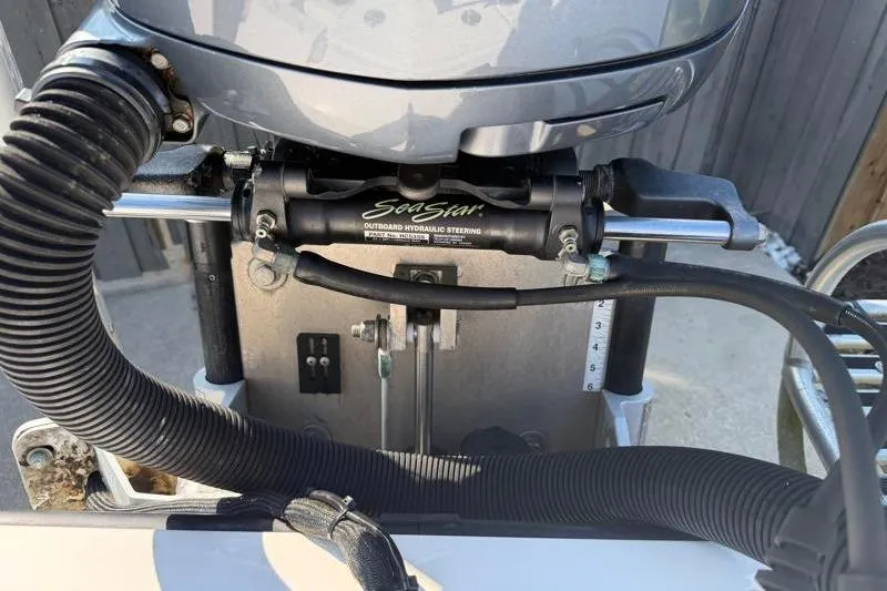 Slide: The Image of Outboard hydraulic steering system on a 2012 Edgewater 240 Inshore boat. - 67