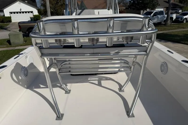Slide: The Image of 2012 Edgewater 240 Inshore boat with stainless steel rod holders and seating. - 69