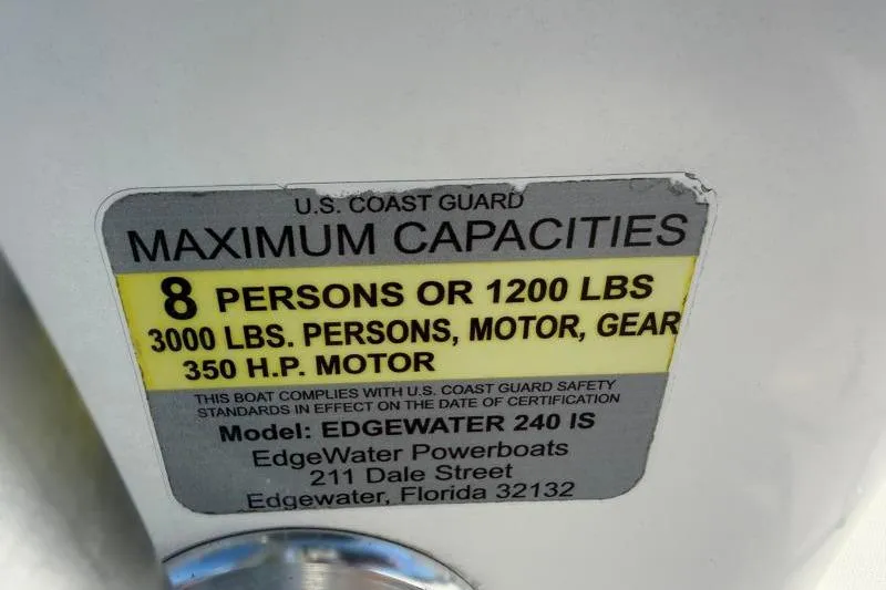 Slide: The Image of Edgewater 240 Inshore 2012 capacity label: 8 persons, 1200 lbs, 350 HP motor. - 76