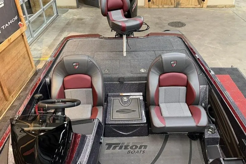 Slide: The Image of 2026 Triton 20XP Patriot boat interior with red and gray seating. - 11