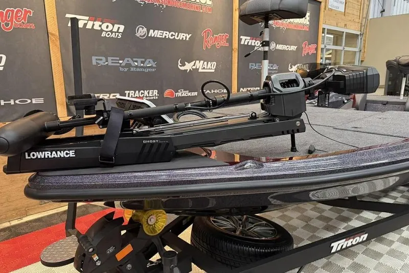 Slide: The Image of 2026 Triton 20XP Patriot boat with Lowrance Ghost trolling motor on display. - 5