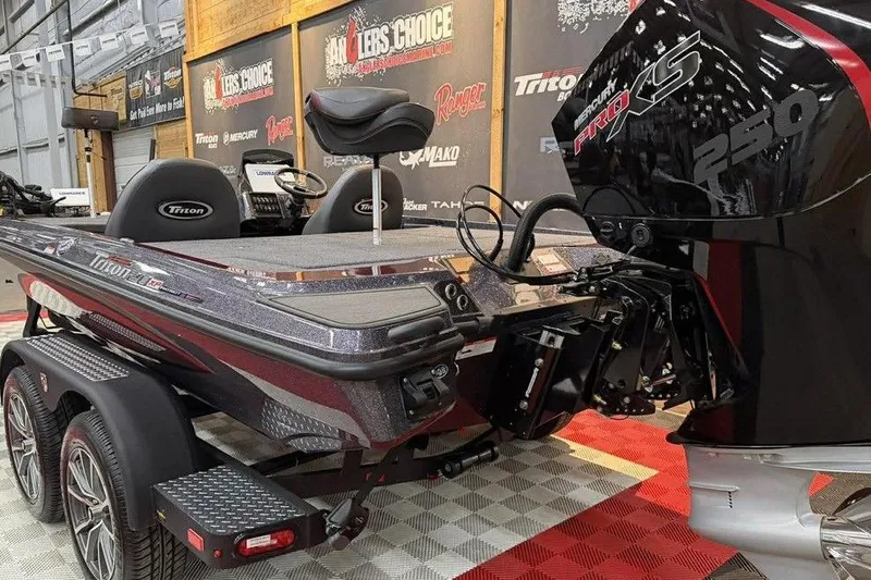 Slide: The Image of 2026 Triton 20XP Patriot boat with Mercury Pro XS 250 engine in showroom. - 8