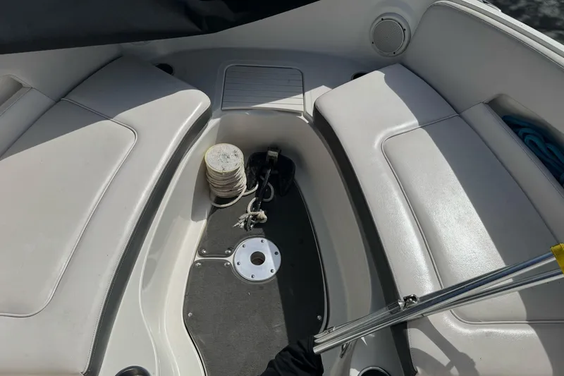 Slide: The Image of Interior view of a 2012 Sea Ray 240 Sundeck boat with seating and anchor storage. - 23