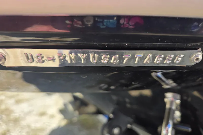 Slide: The Image of 2026 Stingray 231 DC boat identification number plate close-up. - 13