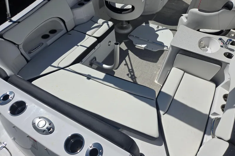 Slide: The Image of Interior of 2026 Stingray 231 DC boat with white seating and cup holders. - 3