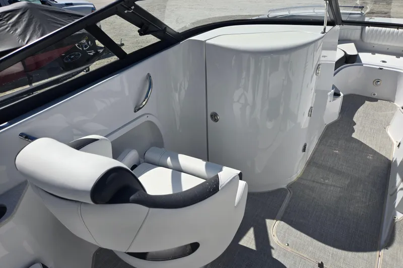Slide: The Image of 2026 Stingray 231 DC boat interior with sleek seating and modern design. - 5