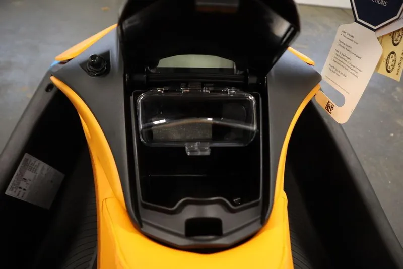 Slide: The Image of 2026 Sea-Doo Spark Trixx for 3, open storage compartment, yellow and black design. - 12