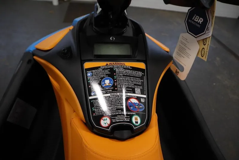 Slide: The Image of 2026 Sea-Doo Spark Trixx dashboard with warning labels and iBR instructions. - 13