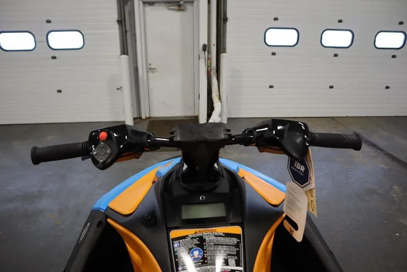 Slide: The Image of 2026 Sea-Doo Spark Trixx for 3 handlebars in a garage setting. - 14