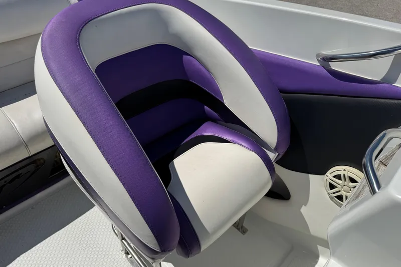 Slide: The Image of Purple and white seat on a 1999 Baja 25 Outlaw boat. - 14
