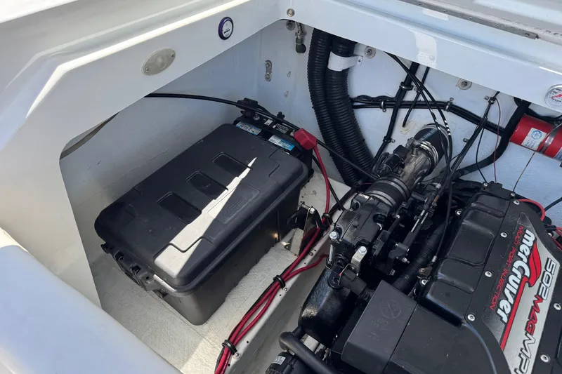 Slide: The Image of Engine compartment of a 1999 Baja 25 Outlaw boat with MerCruiser engine. - 17