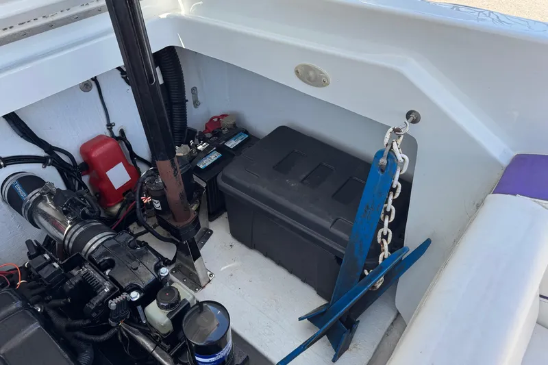 Slide: The Image of Engine compartment of a 1999 Baja 25 Outlaw boat with anchor and battery box. - 18