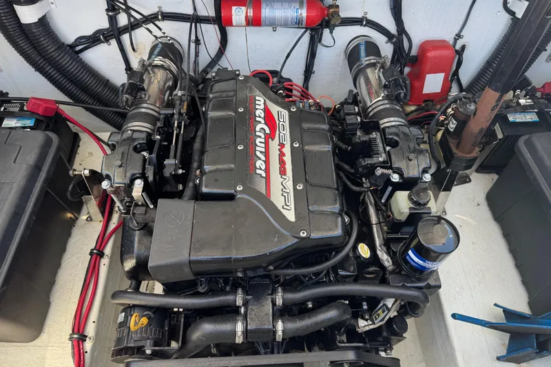 Slide: The Image of Engine compartment of a 1999 Baja 25 Outlaw boat with MerCruiser 502 MAG MPI. - 19