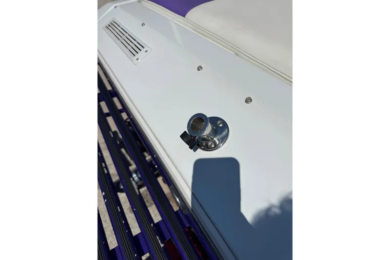 Slide: The Image of 1999 Baja 25 Outlaw boat deck with metal fitting and vent detail. - 6