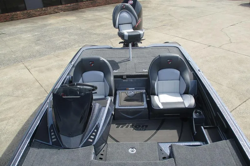 Slide: The Image of 2026 Triton 20XP Patriot boat interior with dual seats and steering console. - 7