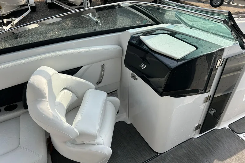 Slide: The Image of 2023 Four Winns HD8 OB boat interior with white seating and sleek design. - 12