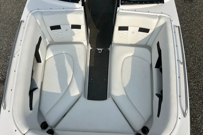 Slide: The Image of 2023 Four Winns HD8 OB boat interior with white cushioned seating and sleek design. - 16