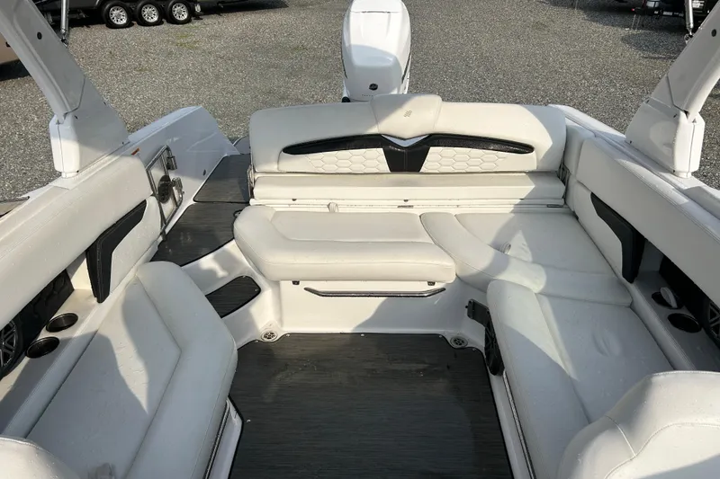 Slide: The Image of 2023 Four Winns HD8 OB boat interior with white seating and modern design. - 8