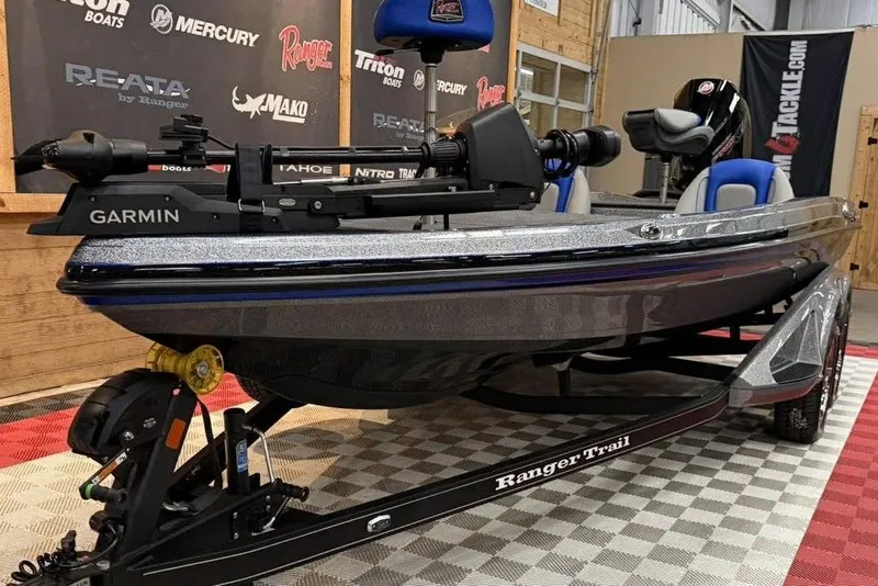 Slide: The Image of 2026 Ranger Z518 Cup-Equipped boat with Garmin technology on display indoors. - 12