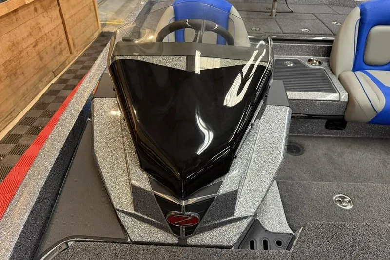Slide: The Image of 2026 Ranger Z518 Cup-Equipped boat interior with sleek design and blue seating. - 14
