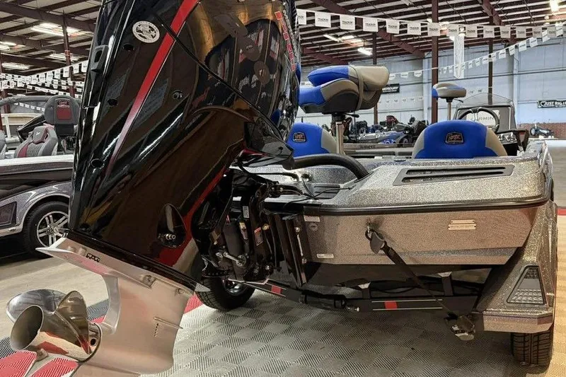 Slide: The Image of 2026 Ranger Z518 Cup-Equipped boat with powerful outboard motor in showroom. - 4