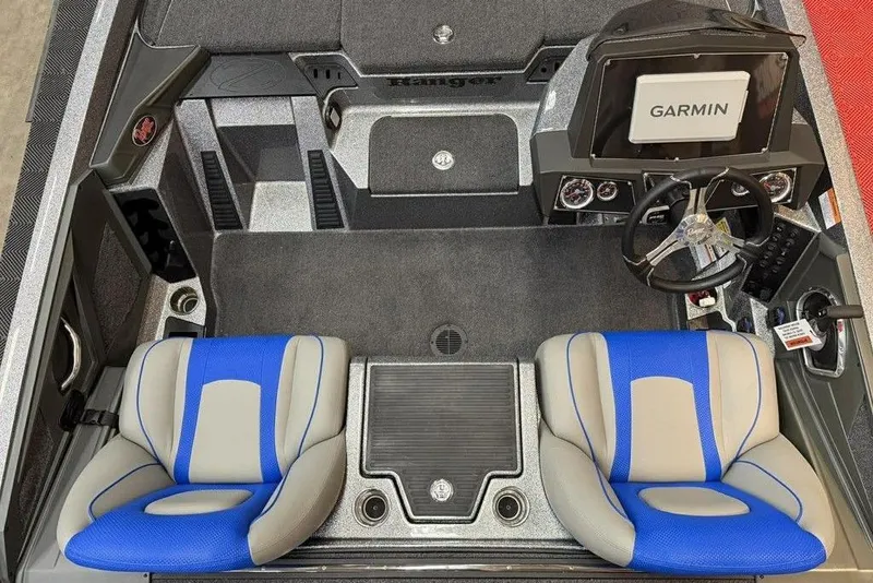 Slide: The Image of 2026 Ranger Z518 Cup-Equipped boat interior with Garmin navigation system and blue-gray seating. - 7
