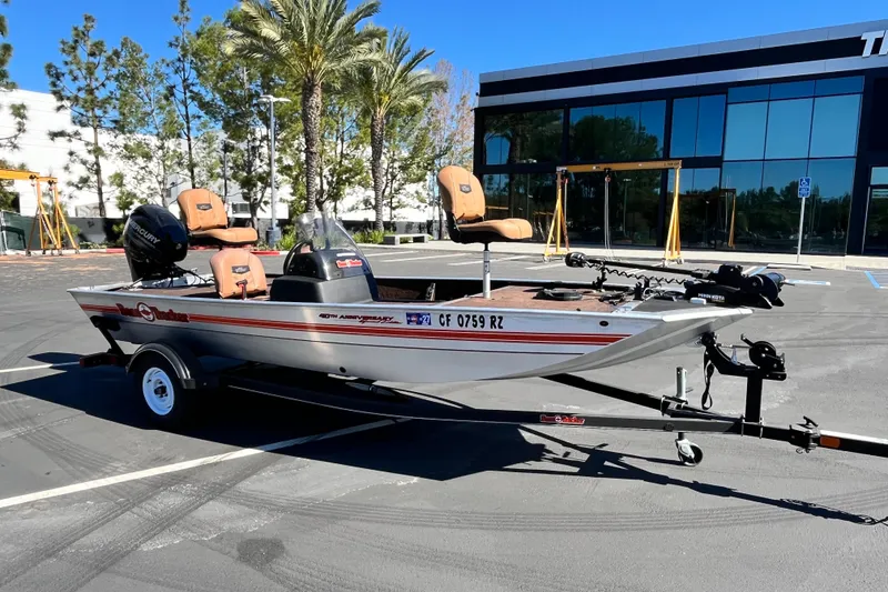 Slide: The Image of 2018 TRACKER BOAT Classic 18 on trailer in parking lot, sunny day. - 4