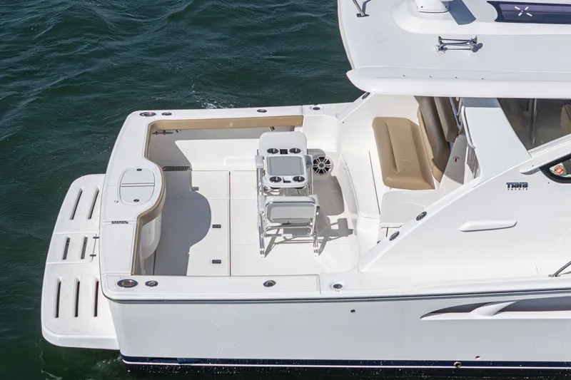 Slide: The Image of 2018 Tiara Yachts 43 Open, luxurious deck on the water. - 10